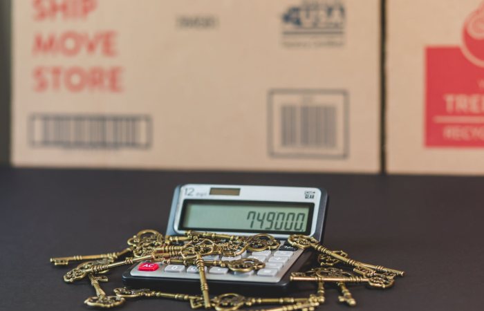 A calculator with vintage keys symbolizes real estate investment and mortgage calculations.